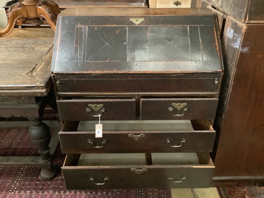 A mid 18th century oak bureau, width 88cm, depth 50cm, height 105cm